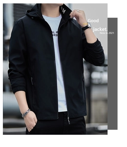 Detail of men's casual hooded jacket featuring side zipper pockets and elastic cuffs