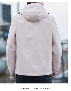 Rear view of men's hooded windbreaker in light pink with adjustable drawstring and seam detail