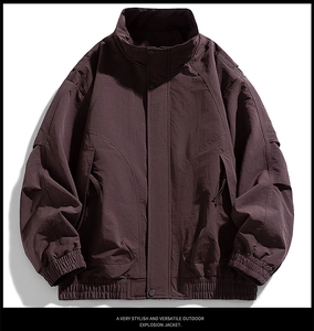 Detail of windproof men's jacket showing ribbed cuffs and snap button closure