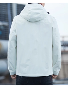 Rear view of a men's hooded windbreaker jacket in light grey with technical back stitching