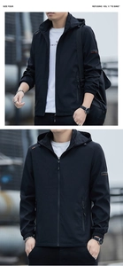 Detail of men's black hooded windbreaker with zip-up front and elastic cuffs in outdoor setting