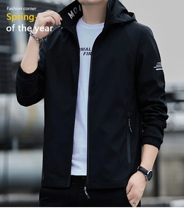 Detail of men's black hooded windbreaker jacket with zipper pocket and printed neck tape