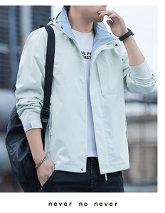Detail showing hooded windbreaker jacket with light blue lining and interior pocket
