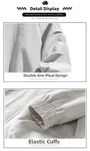 Detail view of double-arm pleated stitching and elastic cuffs on light gray tech jacket
