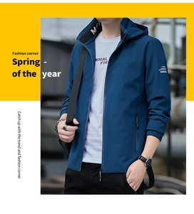 Detail of man casual navy hooded jacket with zipper pockets and urban sport style texture