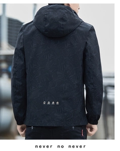 Detailed back view of men's hooded windbreaker with dark tropical palm leaf print