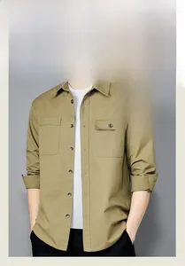 Detailed close-up of khaki utility shirt with dual chest pockets and buttoned collar