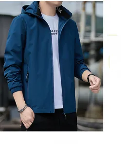 Detail of navy blue hooded jacket featuring stand collar and functional zippers