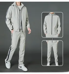 Détail de l'ensemble de sport gris pour homme avec veste à capuche et pantalon assorti