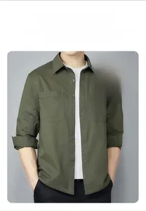 Detail of army green cotton work shirt featuring large flap pockets and breathable fabric