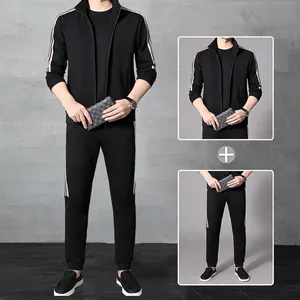 Men's black elastic sports suit featuring zip jacket and joggers with white side stripes