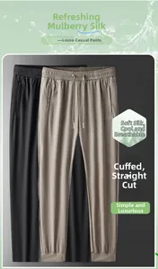 Detailed texture of black and beige ice silk fabric for breathable summer joggers