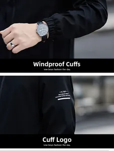 Detail of elastic windproof cuffs and white graphic print on a black men's jacket