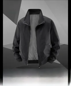 Detailed macro view of black cotton flight jacket with ribbed collar and metal zipper texture