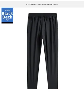 Vue arrière du pantalon noir en soie glacée avec taille élastique et tissu respirant
