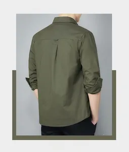 Detail of army green cotton work shirt featuring reinforced back yoke and durable canvas texture