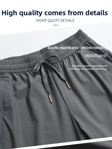 Détail du pantalon en soie glacée gris foncé avec taille élastique et coutures anti-torsion