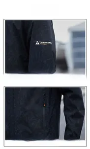 Detail of waterproof zipper and leaf texture print on dark grey outdoor hooded jacket