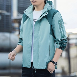 Men's hooded windproof outdoor jacket in mint green and dark green patchwork design