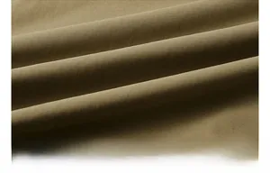 Macro shot of durable brown cotton twill fabric with soft texture and tight weave detail