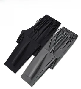 Flat lay of men's quick-dry joggers featuring elastic drawstring waist and zip pockets