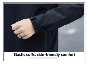 Detail of adjustable elastic cuff with Velcro on a dark water-resistant hooded jacket