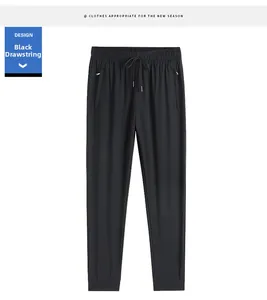 Detail of men's black ice silk jogger with drawstring waist and zipper pockets