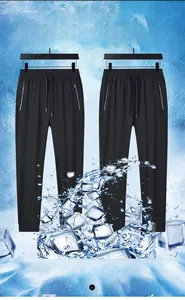 Close-up of black ice silk pants featuring zipper pockets and cooling fabric texture