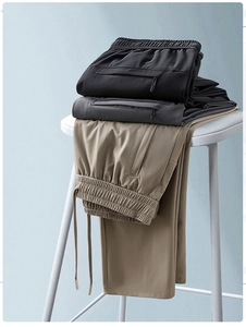 Detail of waist drawstring and textured quick-dry fabric on three colors of ice silk pants