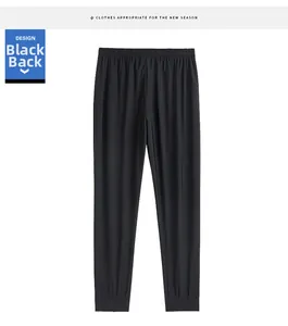 Detail view of the back of black quick-dry ice silk joggers with elastic waist and cuffs