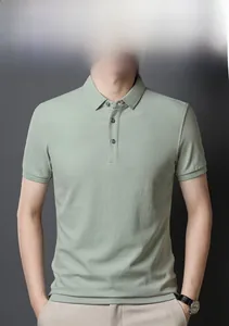 Detail of light sage green men's Polo shirt featuring ribbed cuffs and three-button placket