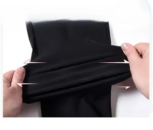 Detail showing the super elastic stretch of the black high-elasticity fabric on men's pants