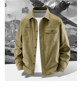Detail of khaki cotton utility shirt featuring dual chest pockets and durable texture