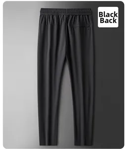 Detailed back view of black quick-dry pants featuring elastic waist and hidden zipper pocket