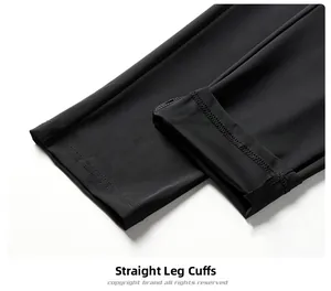 Detailed macro view of the straight hem and smooth ice silk fabric on black trousers