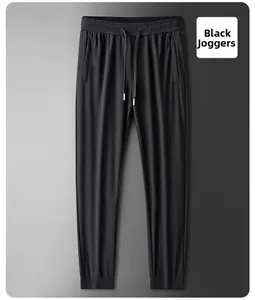 Detail of men's black ice silk joggers featuring drawstring waist and elastic cuffs