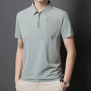 Detail of grey-green men's polo shirt with half-zip collar and vertical chest pocket
