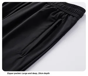 Detail of elastic waist and 20cm deep zipper pocket on black ice silk pants