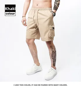 Detail of khaki cargo shorts showing the elastic drawstring waist and side pocket