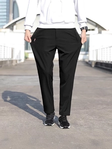 Pantalon de sport élastique noir pour homme avec poches zippées et coupe slim légère
