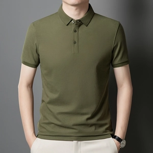 Detailed view of olive green polo shirt with mercerized pique texture and ribbed cuffs