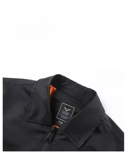 Detail of MA-1 bomber jacket collar with orange lining and gold military woven label