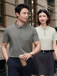 Men's olive and women's beige business casual polo shirts with zipper neck and pockets