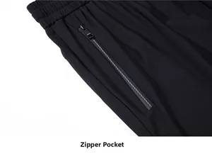 Detail of men's ice silk pants featuring an elastic waist and a hidden zipper pocket