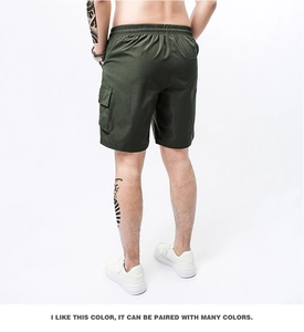 Rear view of loose fit army green cargo shorts featuring elastic waist and side pockets