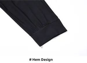 Detail of high-elasticity ribbed cuffs on black ice silk pants with flat stitching