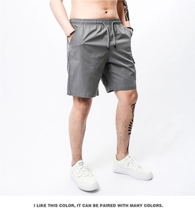 Detailed close-up of dark grey men's casual shorts with elastic drawstring waistband
