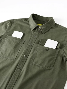 Olive green cotton workwear shirt for men featuring dual chest pockets and twill texture