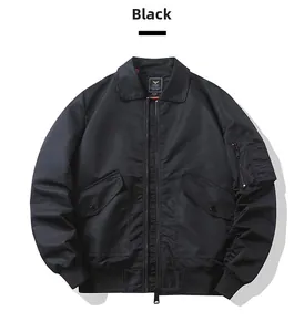 Detail of black bomber jacket featuring ribbed cuffs and a functional utility sleeve pocket