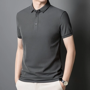 Close-up of dark grey men's short sleeve Polo shirt featuring detailed mercerized cotton texture